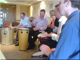 Building rapport between staff through Active Rhythmology drumming activities.